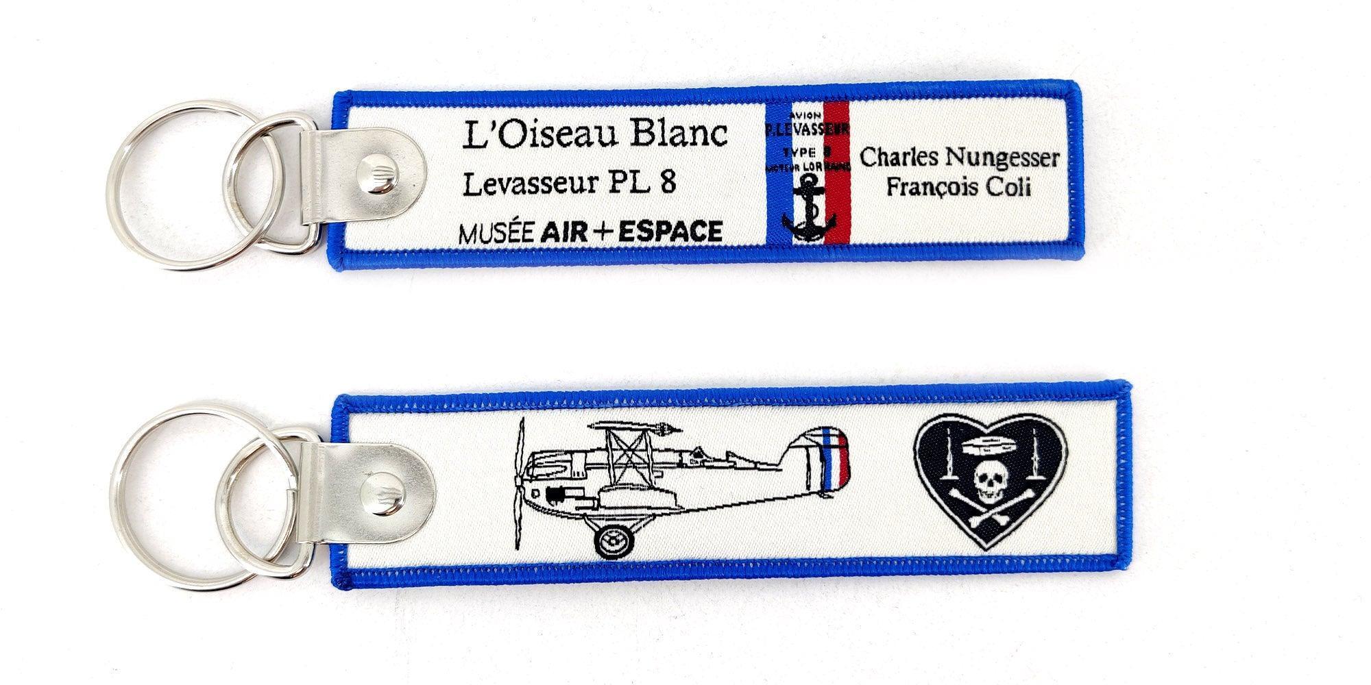 L'Oiseau Blanc porte-clés flamme brodé avion