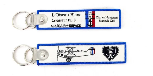 L'Oiseau Blanc porte-clés flamme brodé avion