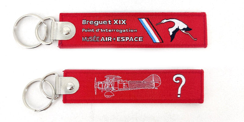 La Boutique du Pilote porte-clés flamme point d'interrogation rouge